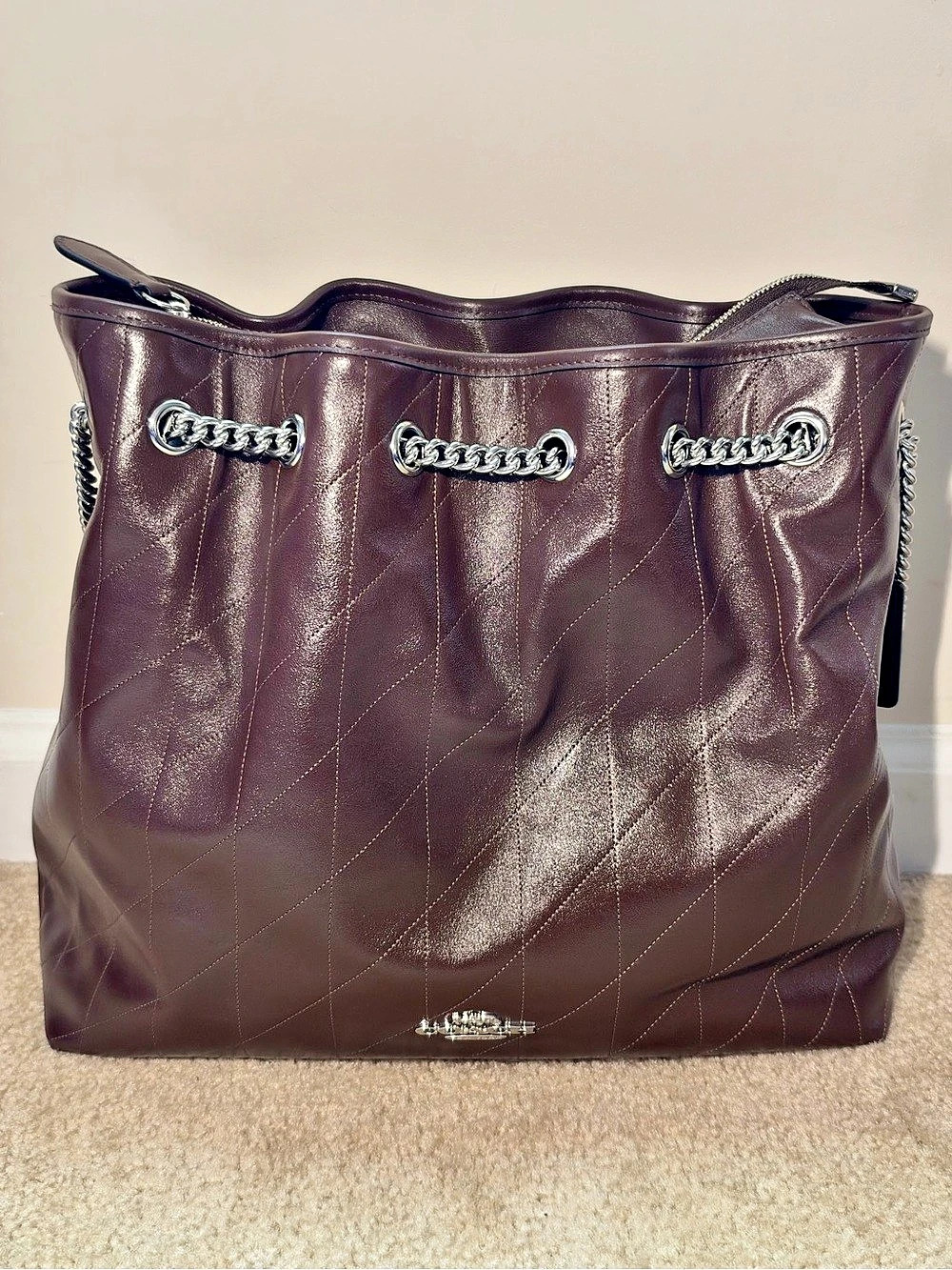 Coach Evelyn Large Shoulder Bag
With Quilting in maple/sliver